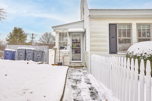 view of snow covered property entrance