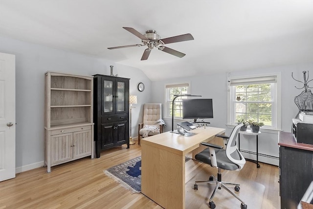 40 Abbott Ln, Chelmsford, MA 01824 - home office with a baseboard radiator, a ceiling fan, light wood-style floors, and vaulted ceiling