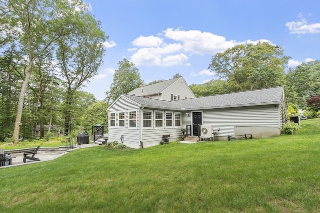 40 Abbott Ln, Chelmsford, MA 01824 - back of property with a lawn and a shingled roof