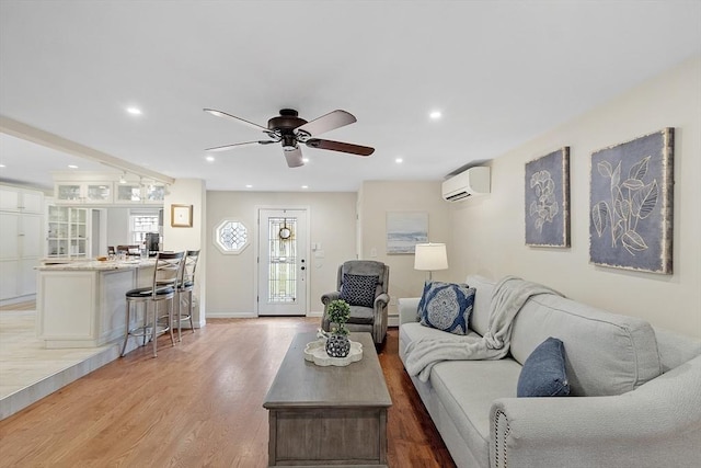 40 Abbott Ln, Chelmsford, MA 01824 - living area featuring a wall unit AC, light wood-style flooring, a ceiling fan, and recessed lighting