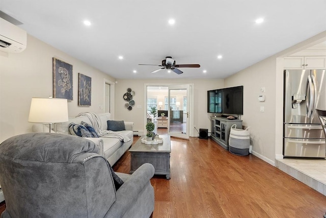 40 Abbott Ln, Chelmsford, MA 01824 - living room featuring an AC wall unit, a ceiling fan, wood finished floors, recessed lighting, and baseboard heating