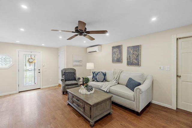 40 Abbott Ln, Chelmsford, MA 01824 - living room with a wall mounted air conditioner, a ceiling fan, wood finished floors, and recessed lighting