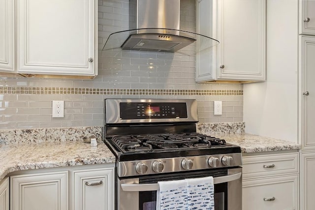 40 Abbott Ln, Chelmsford, MA 01824 - kitchen with gas range, wall chimney exhaust hood, tasteful backsplash, and white cabinets
