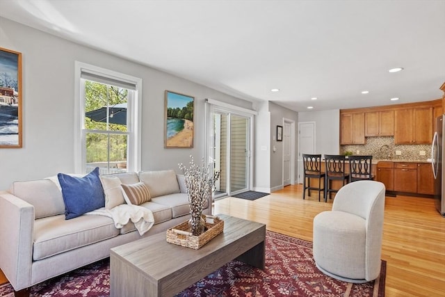 living room featuring recessed lighting and light wood finished floors
