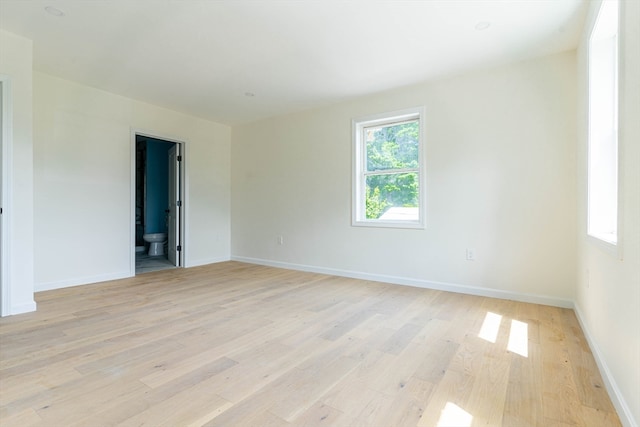 spare room with light hardwood / wood-style floors