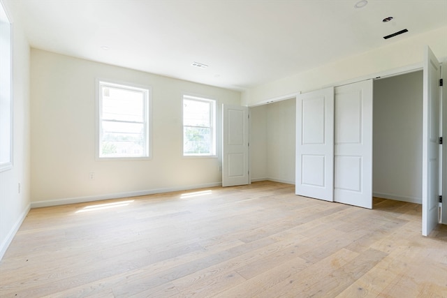 unfurnished bedroom with light hardwood / wood-style flooring