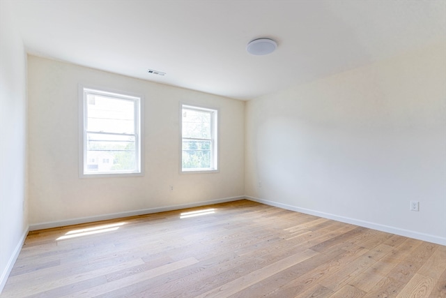 unfurnished room featuring light wood-type flooring