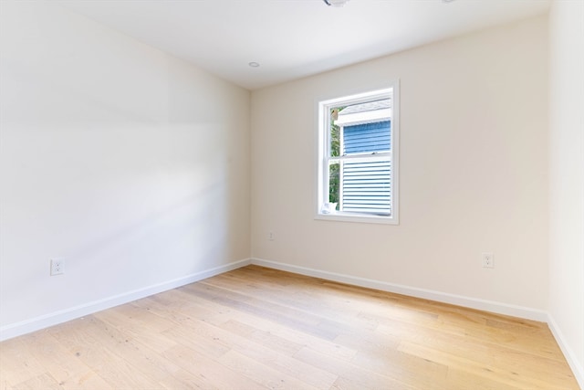 unfurnished room with light hardwood / wood-style flooring