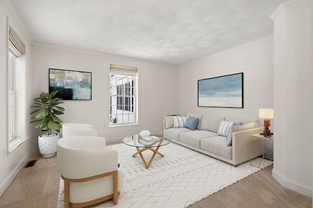 carpeted living area with baseboards, visible vents, and crown molding