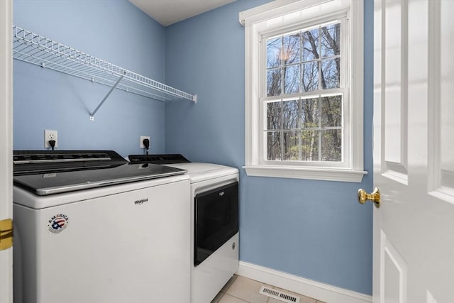 laundry area with washer and dryer, laundry area, visible vents, and plenty of natural light