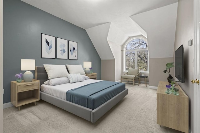 bedroom with light carpet, lofted ceiling, and baseboards