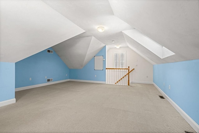 bonus room with visible vents and baseboards