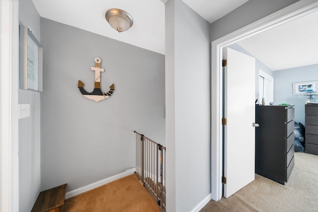 corridor with light colored carpet