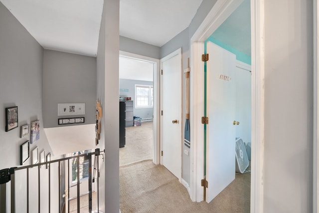 corridor with light colored carpet