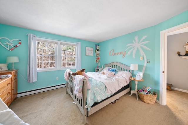 carpeted bedroom featuring baseboard heating