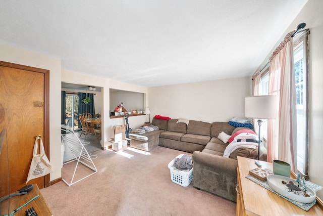 carpeted living room featuring a healthy amount of sunlight