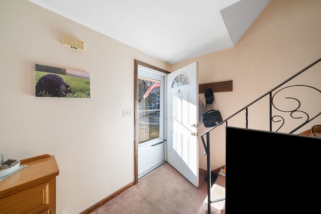 view of carpeted entrance foyer