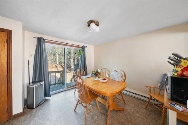 dining space with a baseboard heating unit