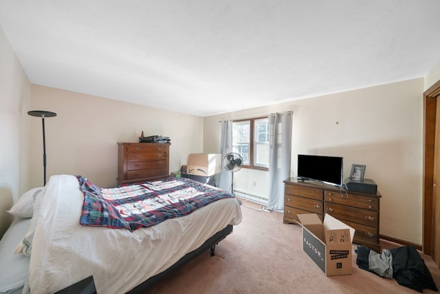 carpeted bedroom featuring a baseboard radiator