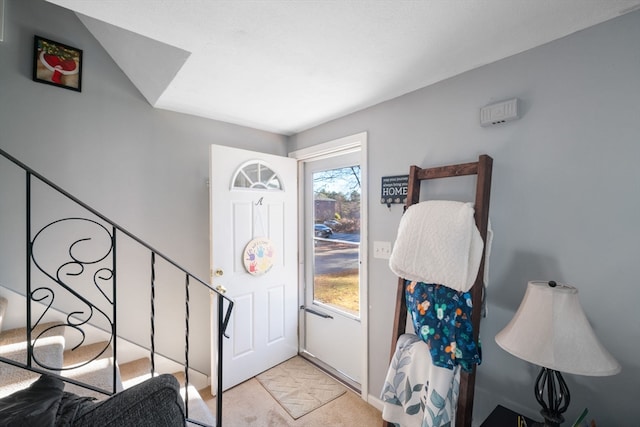 entrance foyer with light carpet