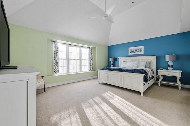 carpeted bedroom featuring ceiling fan and vaulted ceiling