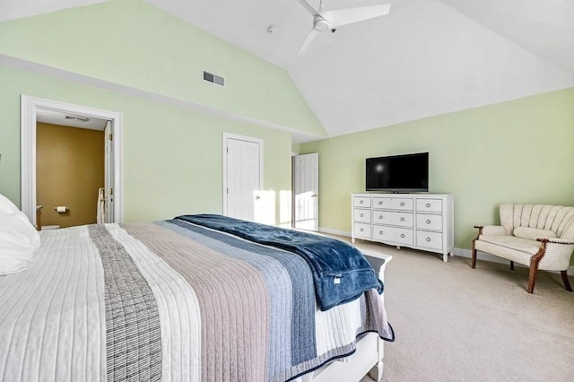 carpeted bedroom featuring ceiling fan and vaulted ceiling