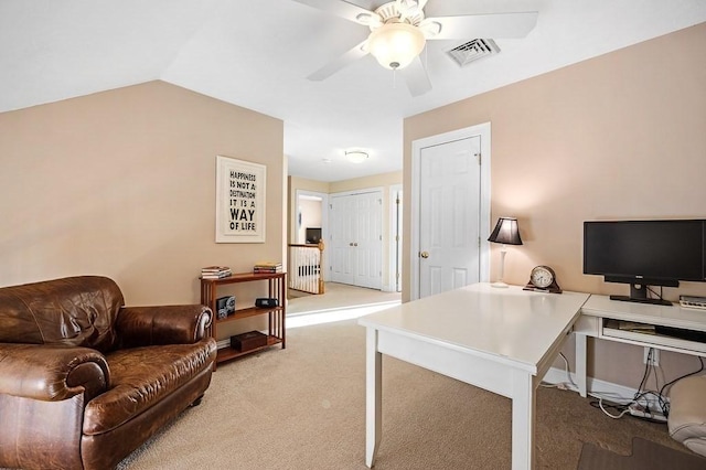 carpeted home office featuring ceiling fan and vaulted ceiling