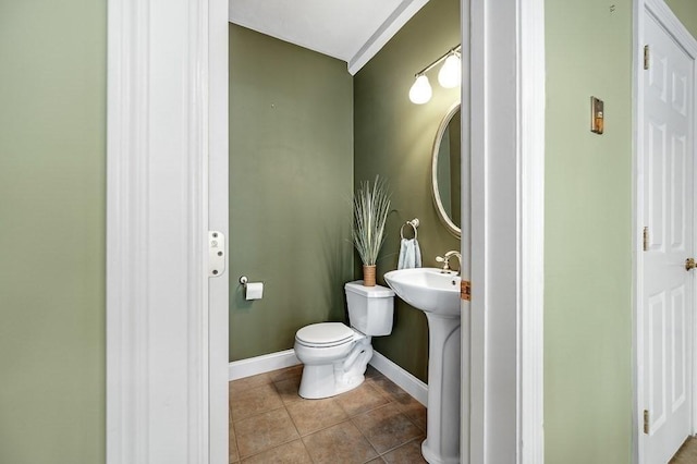 bathroom featuring tile patterned floors and toilet