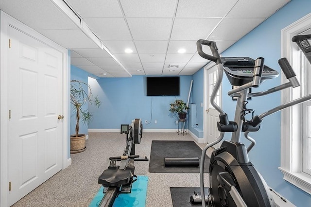 exercise room featuring a paneled ceiling