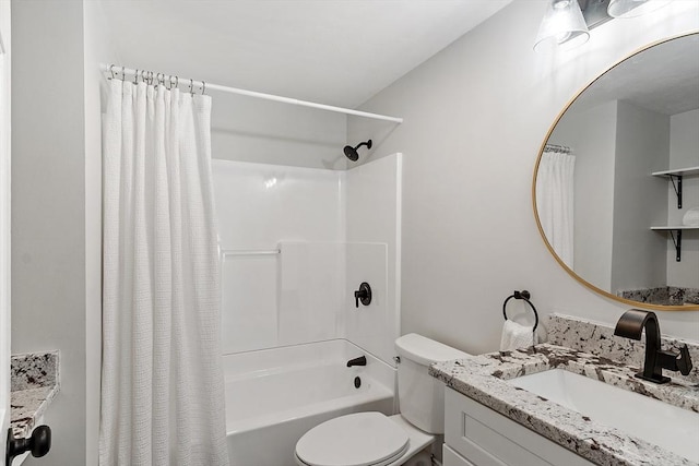 bathroom with toilet, shower / tub combo, and vanity