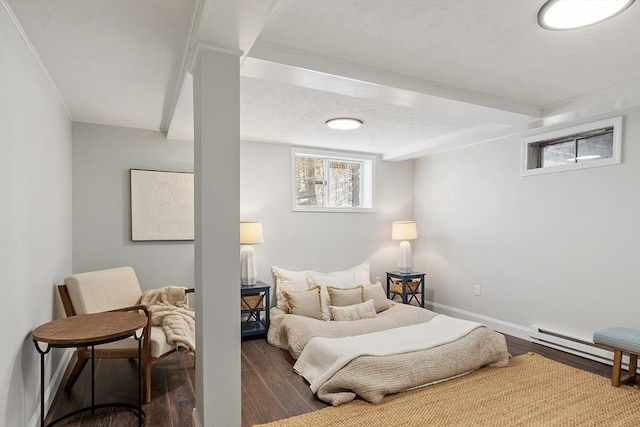 bedroom with dark wood-type flooring, baseboard heating, and baseboards