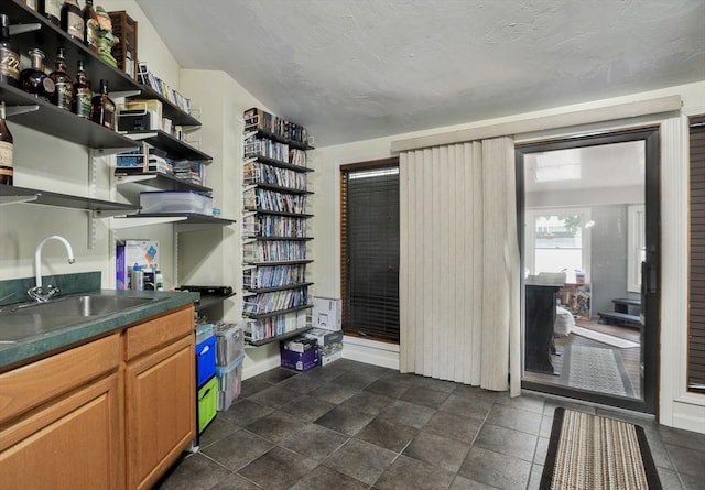 30 Pheasant Ln, Pembroke, MA 02359 - kitchen with open shelves, a sink, and dark countertops