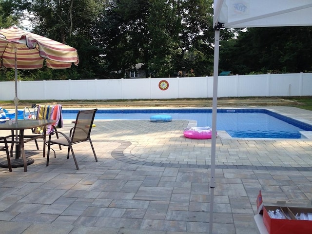 30 Pheasant Ln, Pembroke, MA 02359 - view of swimming pool with a fenced backyard and a patio area