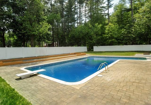 30 Pheasant Ln, Pembroke, MA 02359 - view of pool with a diving board, a patio area, a fenced backyard, and view of scattered trees