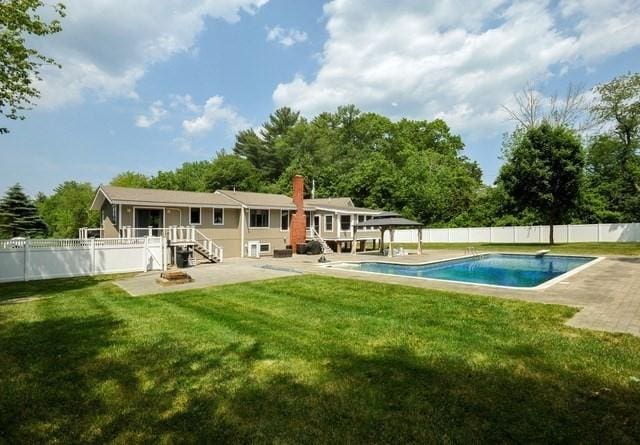 30 Pheasant Ln, Pembroke, MA 02359 - rear view of house featuring a patio area and a chimney