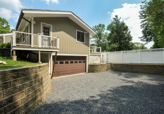 30 Pheasant Ln, Pembroke, MA 02359 - view of property exterior with driveway, an attached garage, and a balcony