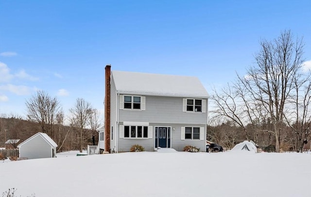 view of front of home featuring a chimney