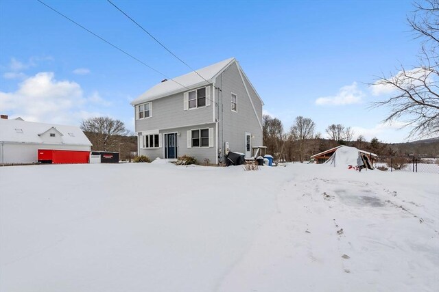 view of snow covered house