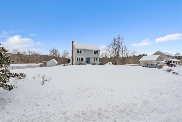 view of snow covered house