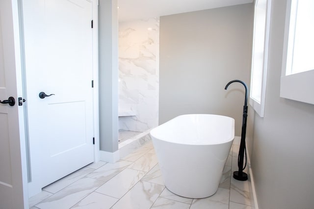 bathroom with shower with separate bathtub and tile patterned floors