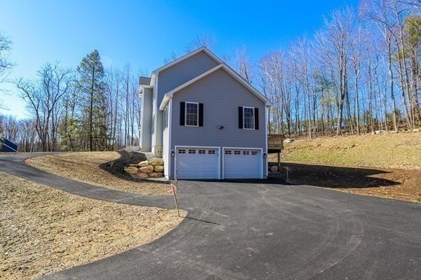 view of side of property with a garage