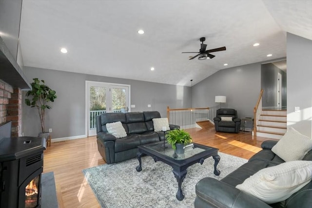 living area with light wood finished floors, recessed lighting, baseboards, and vaulted ceiling