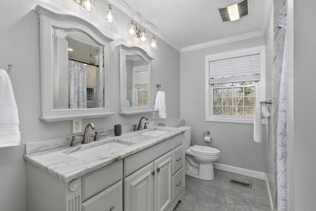 bathroom with crown molding, toilet, visible vents, and a sink