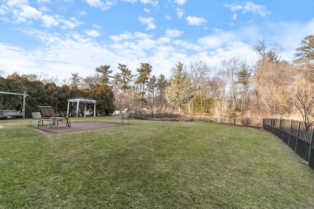 view of yard featuring a patio, fence, and a pergola