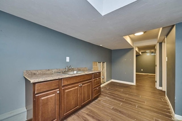 114 Mount Ida Rd Unit A, Boston, MA 02122 - bar area featuring a sink, dark wood-style flooring, and baseboards