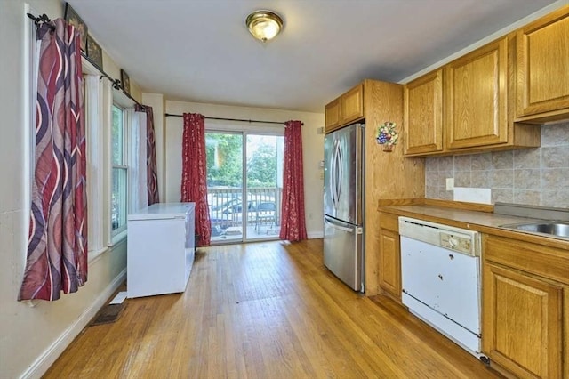 114 Mount Ida Rd Unit A, Boston, MA 02122 - kitchen with dishwasher, freestanding refrigerator, refrigerator, and baseboards