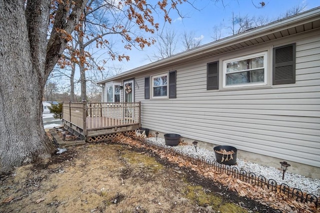 view of side of property featuring a deck