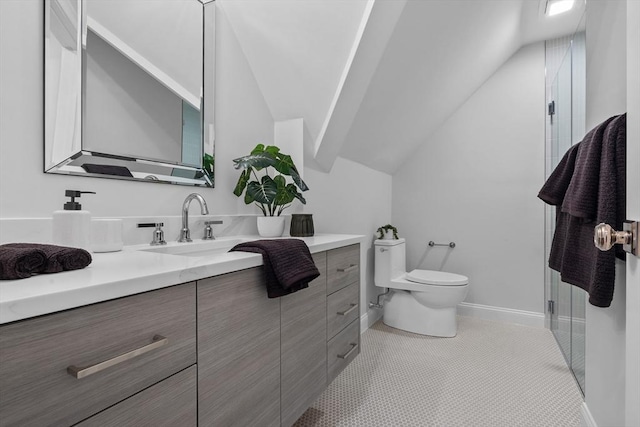 bathroom featuring vaulted ceiling, a shower with shower door, tile patterned flooring, vanity, and toilet