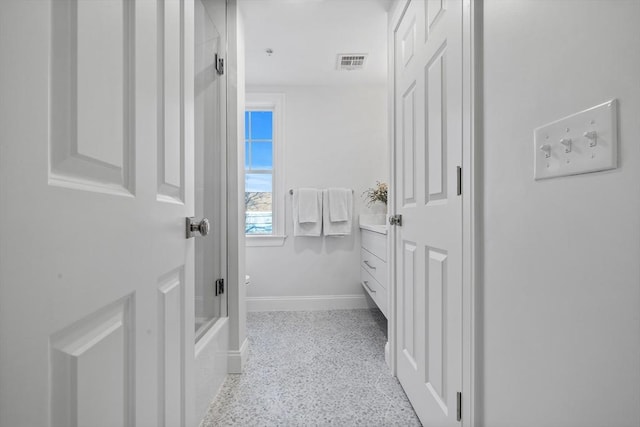 bathroom with vanity and shower / bath combination with glass door