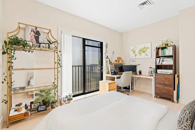 121 Portland St Unit Ph3, Boston, MA 02114 - bedroom with access to exterior, a desk, and wood finished floors